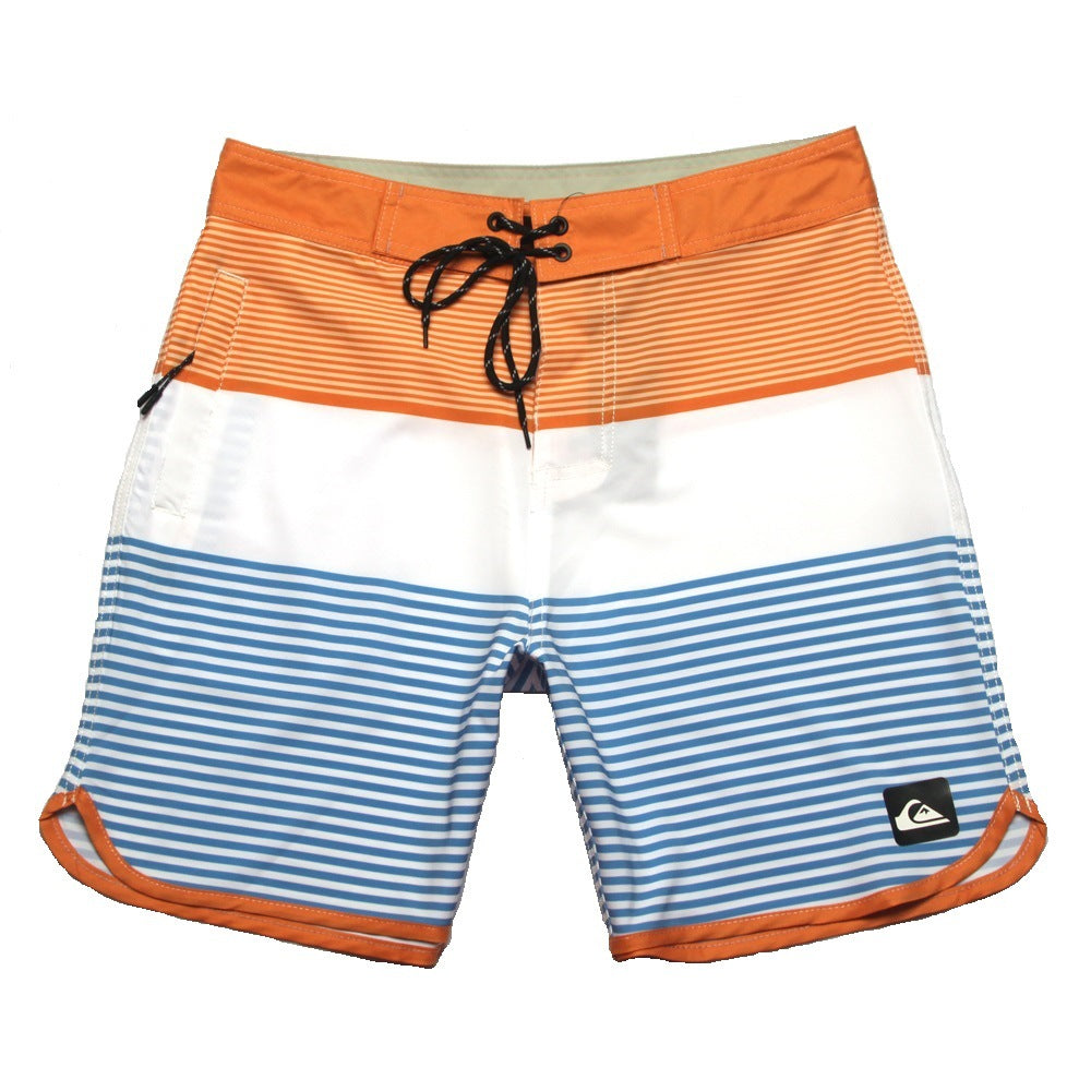 Shorts de plage Quiksilver pour homme, séchage rapide, lavable, grande taille, coupe ample et courte, style détente en station balnéaire.