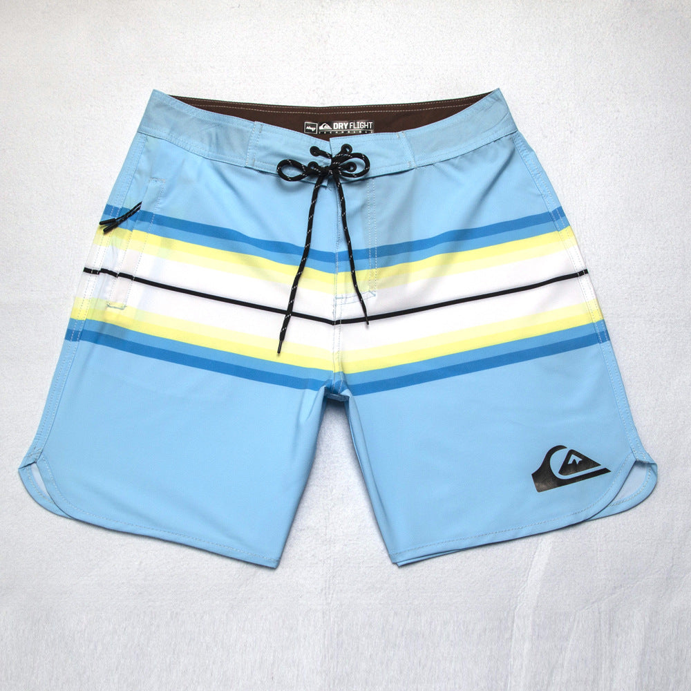 Shorts de plage Quiksilver pour homme, séchage rapide, lavable, grande taille, coupe ample et courte, style détente en station balnéaire.