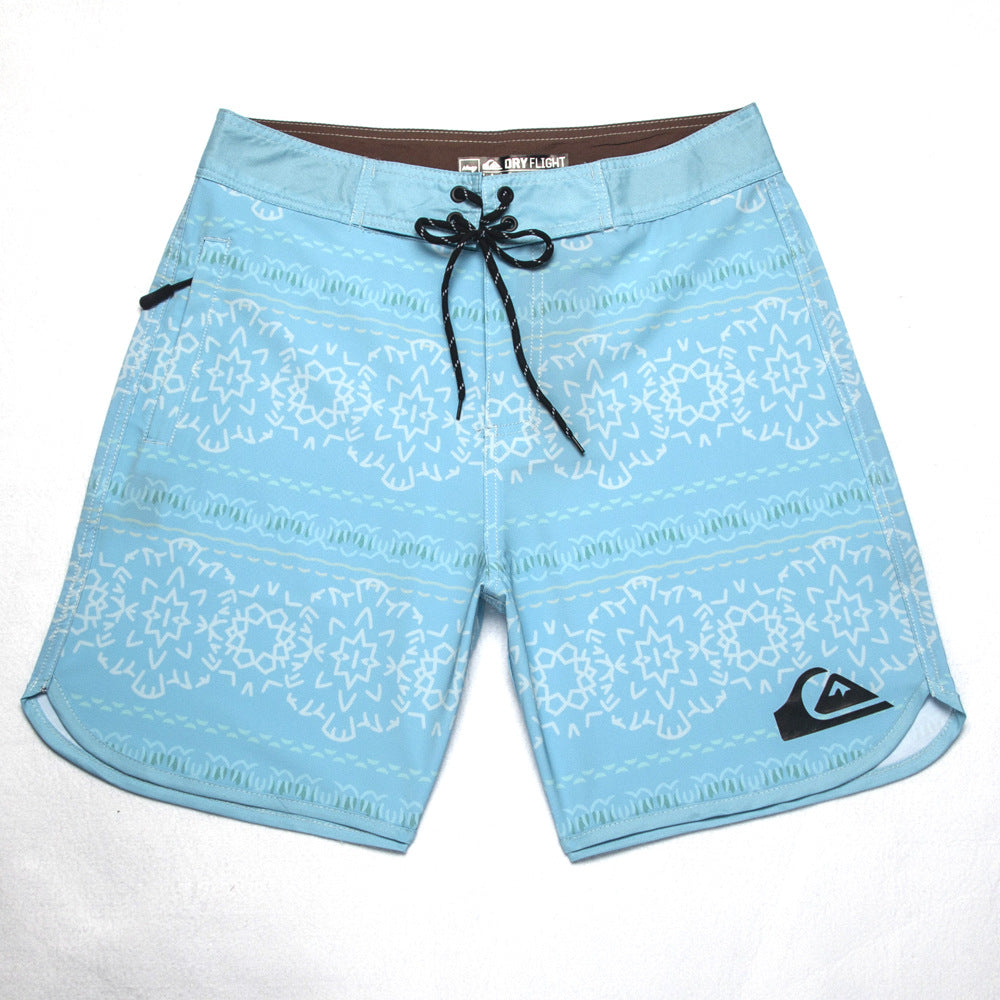 Shorts de plage Quiksilver pour homme, séchage rapide, lavable, grande taille, coupe ample et courte, style détente en station balnéaire.