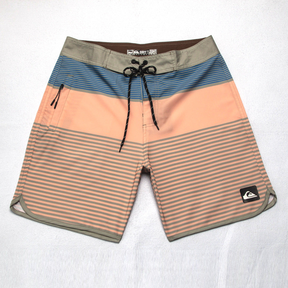 Shorts de plage Quiksilver pour homme, séchage rapide, lavable, grande taille, coupe ample et courte, style détente en station balnéaire.