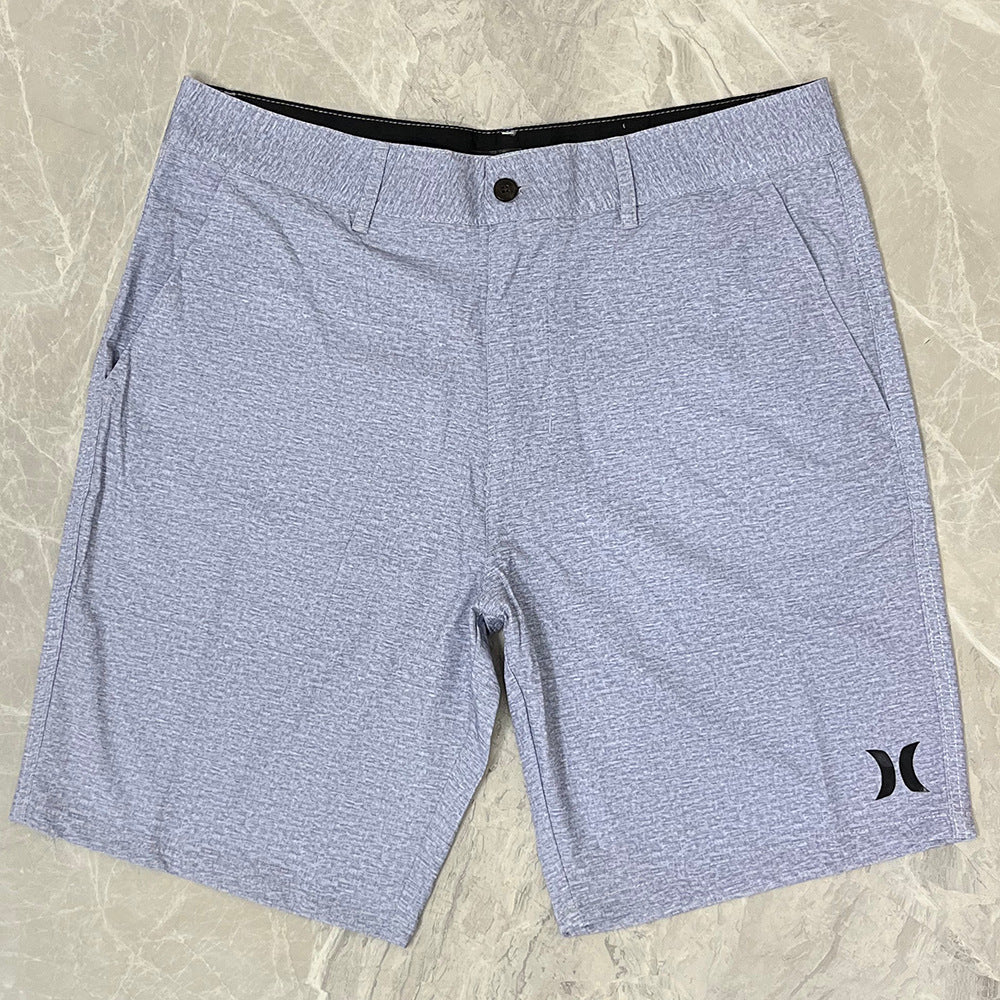Shorts de plage pour homme Hurley, coupe courte, séchage rapide, déperlants, stretch, style décontracté pour surf et détente.