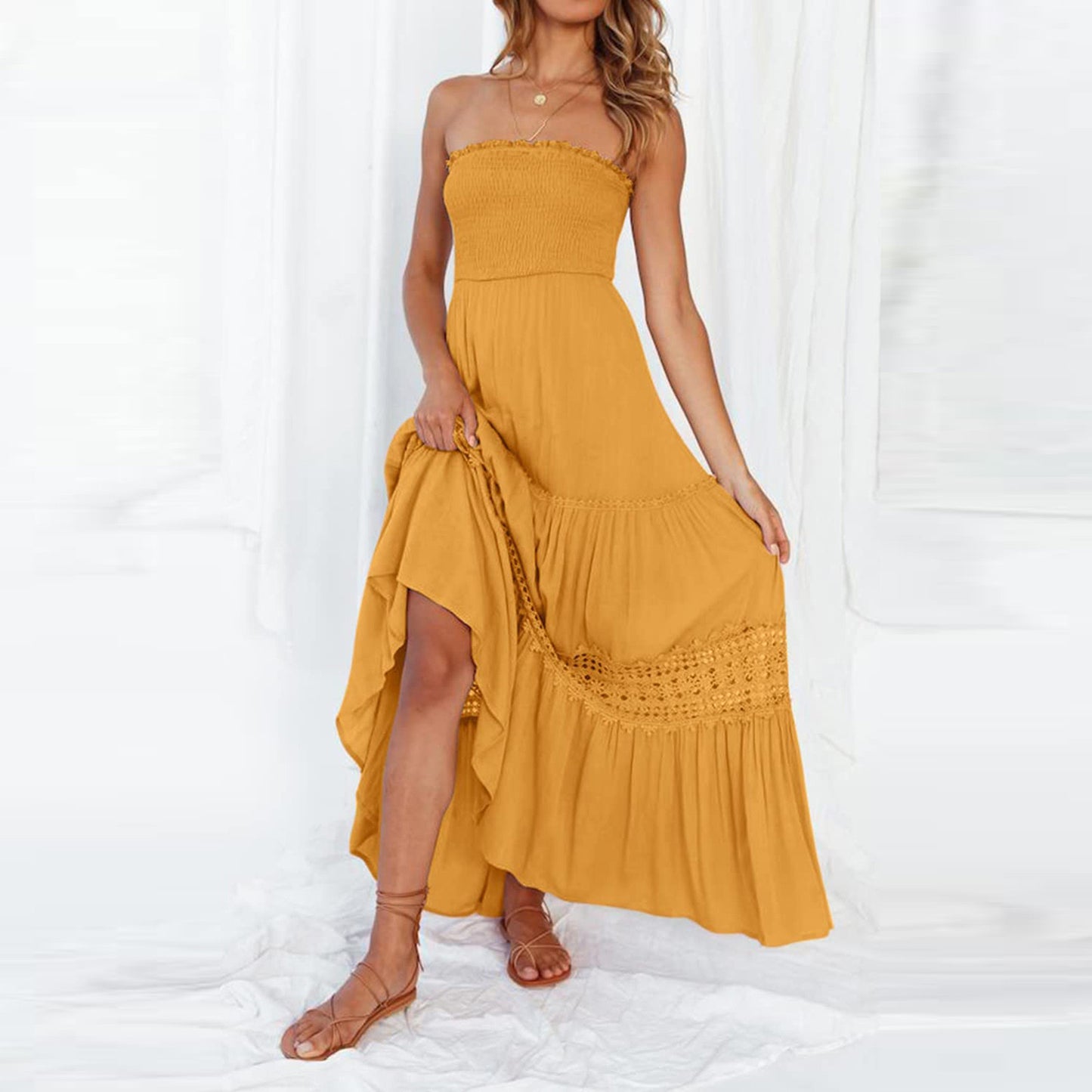 Robe longue sans manches, style bohème vintage, couleur unie, haut bandeau, taille cintrée et coupe élégante.