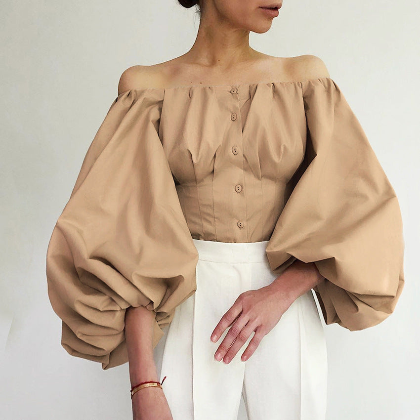 Cross-border 2022 spring and summer new design sense long sleeve bubble balloon sleeve leaky shoulder European and American women's shirt top top