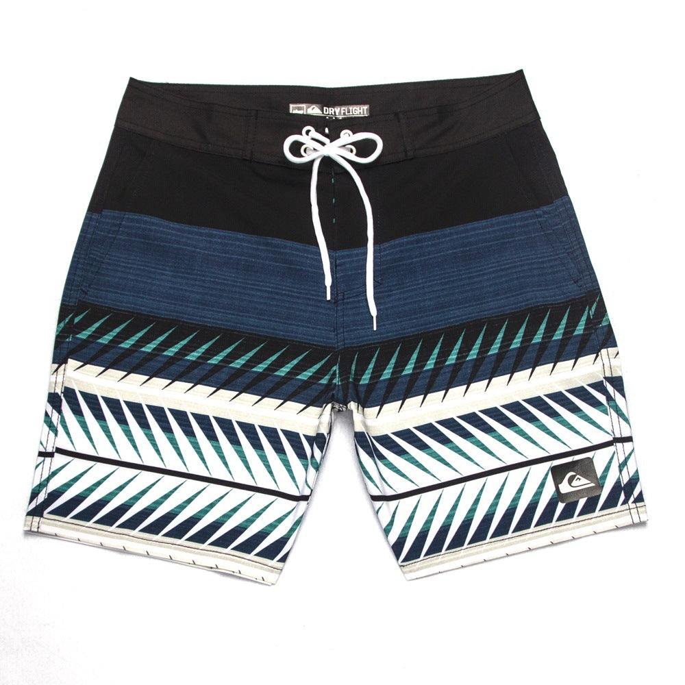 Shorts de plage Quiksilver pour homme, séchage rapide, lavable, grande taille, coupe ample et courte, style détente en station balnéaire.