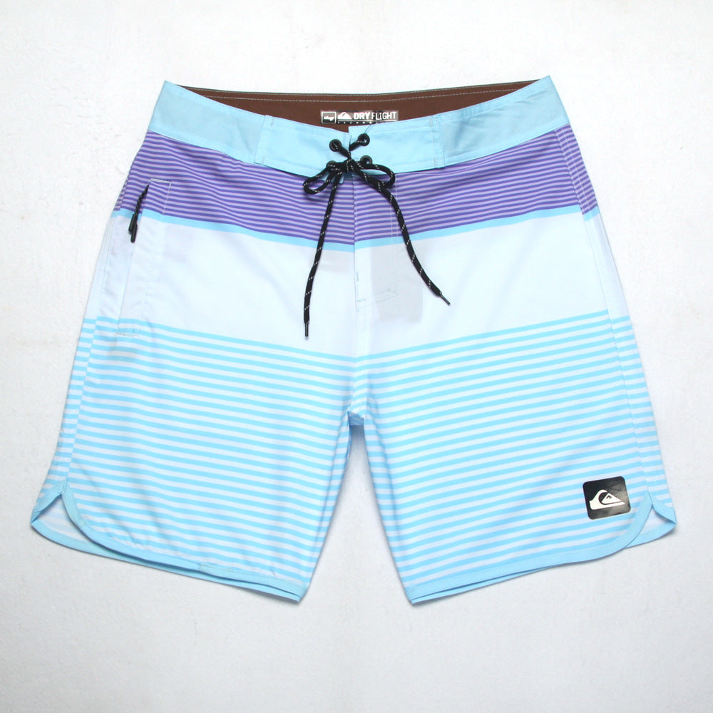 Shorts de plage Quiksilver pour homme, séchage rapide, lavable, grande taille, coupe ample et courte, style détente en station balnéaire.