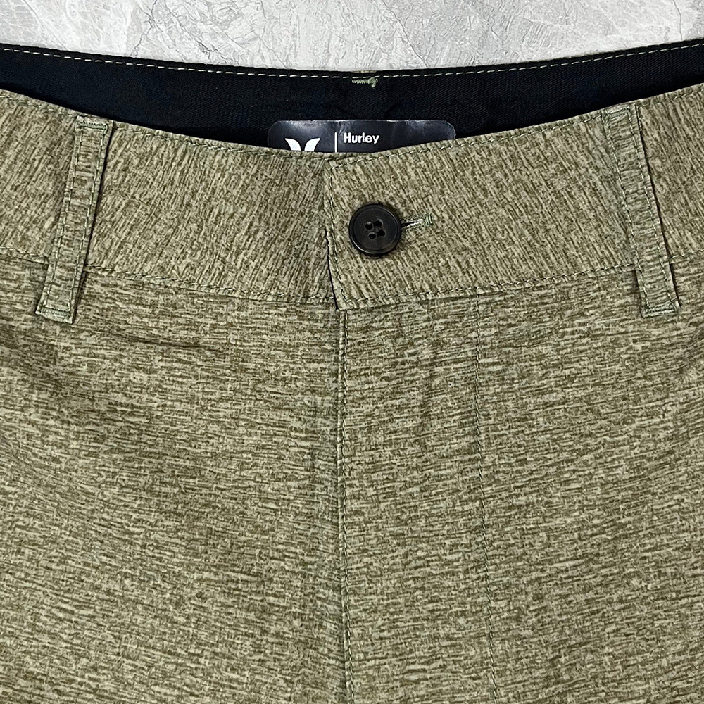 Shorts de plage pour homme Hurley, coupe courte, séchage rapide, déperlants, stretch, style décontracté pour surf et détente.