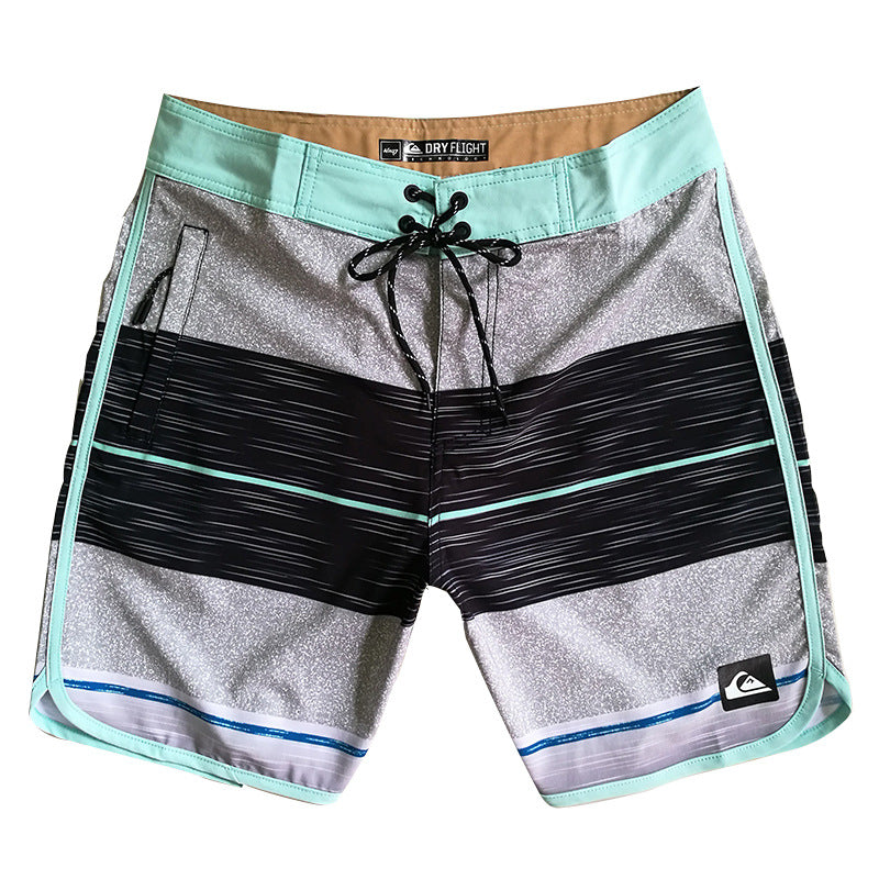 Pantalon de fitness Quiksilver pour homme, adapté au bodybuilding et compétitions, déperlant, séchage rapide, stretch, parfait pour le surf et la plage.