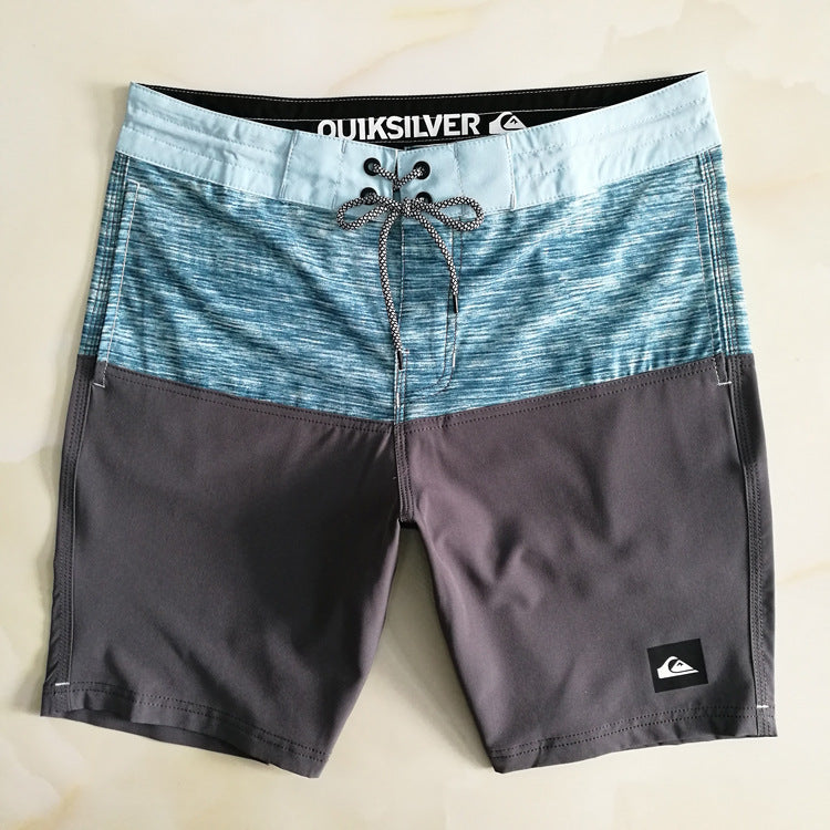 Pantalon de fitness Quiksilver pour homme, adapté au bodybuilding et compétitions, déperlant, séchage rapide, stretch, parfait pour le surf et la plage.