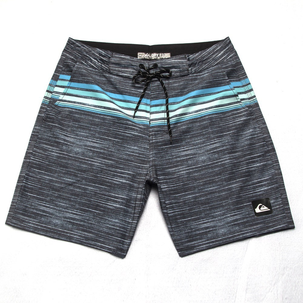 Pantalon de fitness Quiksilver pour homme, adapté au bodybuilding et compétitions, déperlant, séchage rapide, stretch, parfait pour le surf et la plage.