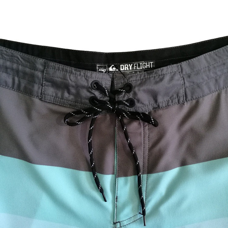 Pantalon de fitness Quiksilver pour homme, adapté au bodybuilding et compétitions, déperlant, séchage rapide, stretch, parfait pour le surf et la plage.