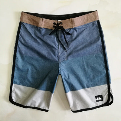 Pantalon de fitness Quiksilver pour homme, adapté au bodybuilding et compétitions, déperlant, séchage rapide, stretch, parfait pour le surf et la plage.