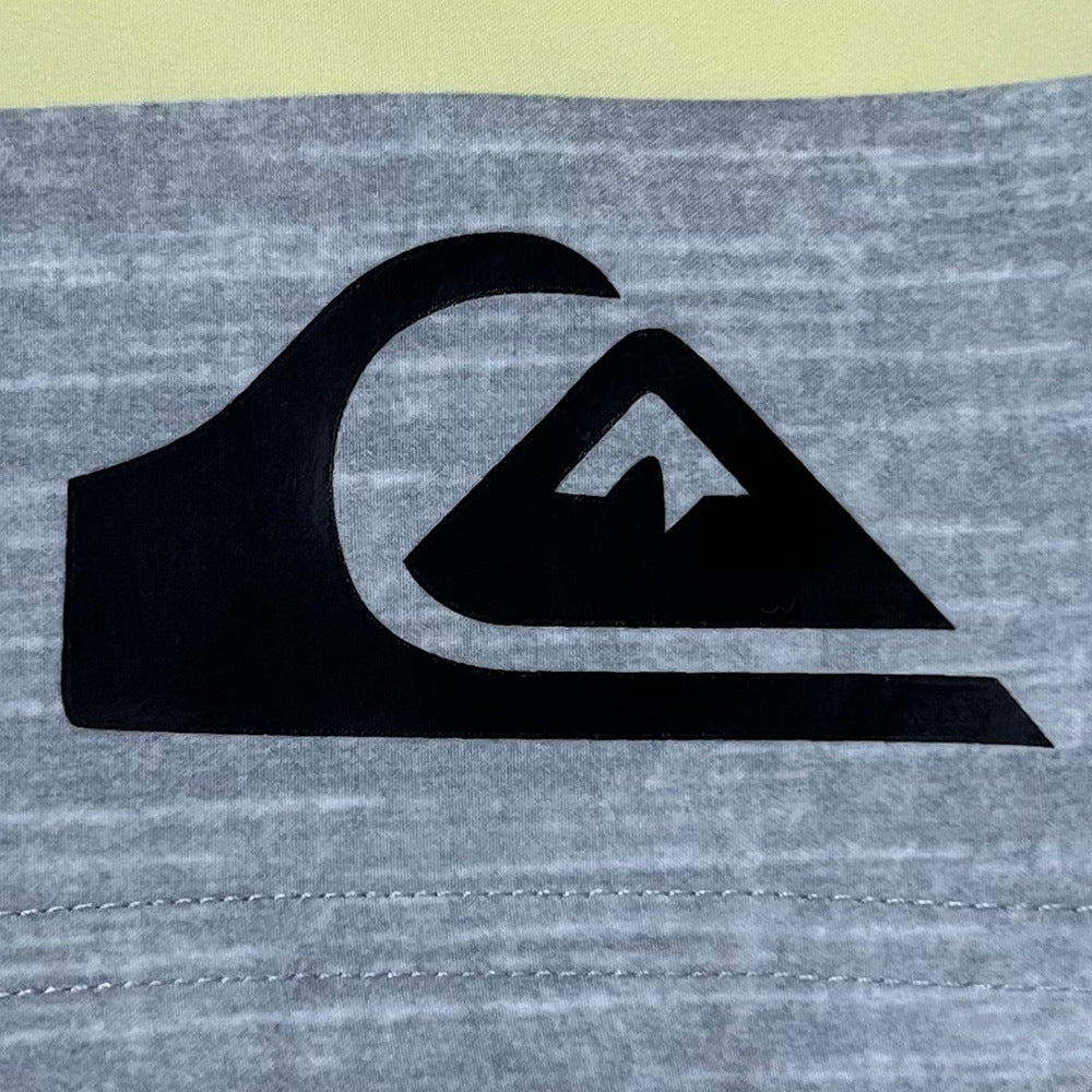 Pantalon de fitness Quiksilver pour homme, adapté au bodybuilding et compétitions, déperlant, séchage rapide, stretch, parfait pour le surf et la plage.