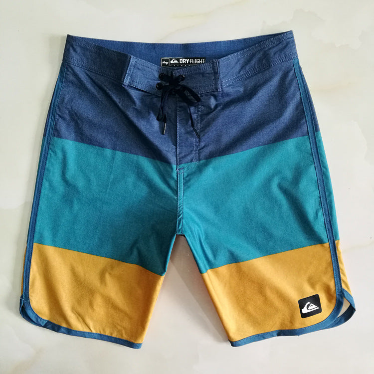 Pantalon de fitness Quiksilver pour homme, adapté au bodybuilding et compétitions, déperlant, séchage rapide, stretch, parfait pour le surf et la plage.