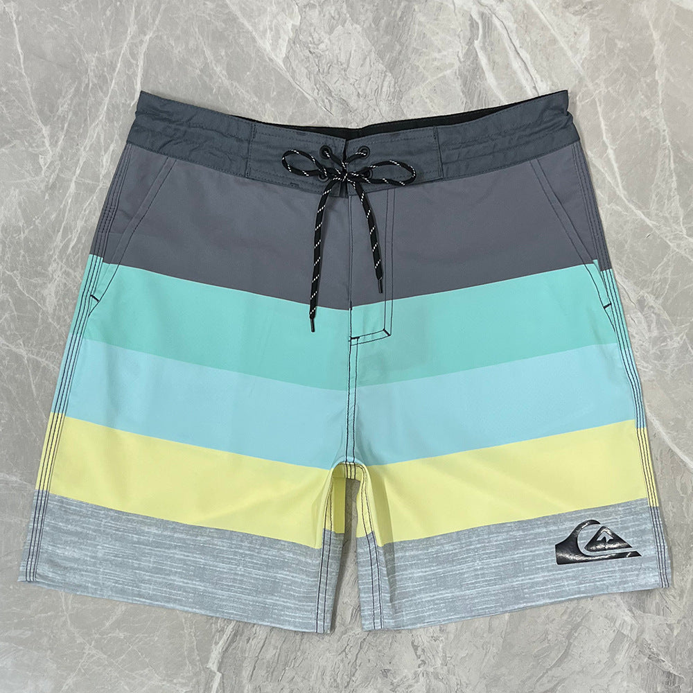 Pantalon de fitness Quiksilver pour homme, adapté au bodybuilding et compétitions, déperlant, séchage rapide, stretch, parfait pour le surf et la plage.